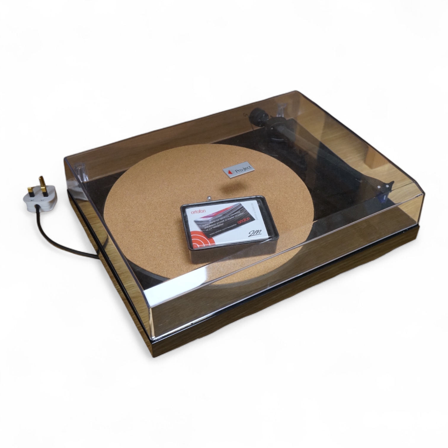 A Project Debut Carbon turntable with Ortofon 2m blue stylus and spare Ortofon 2m red stylus